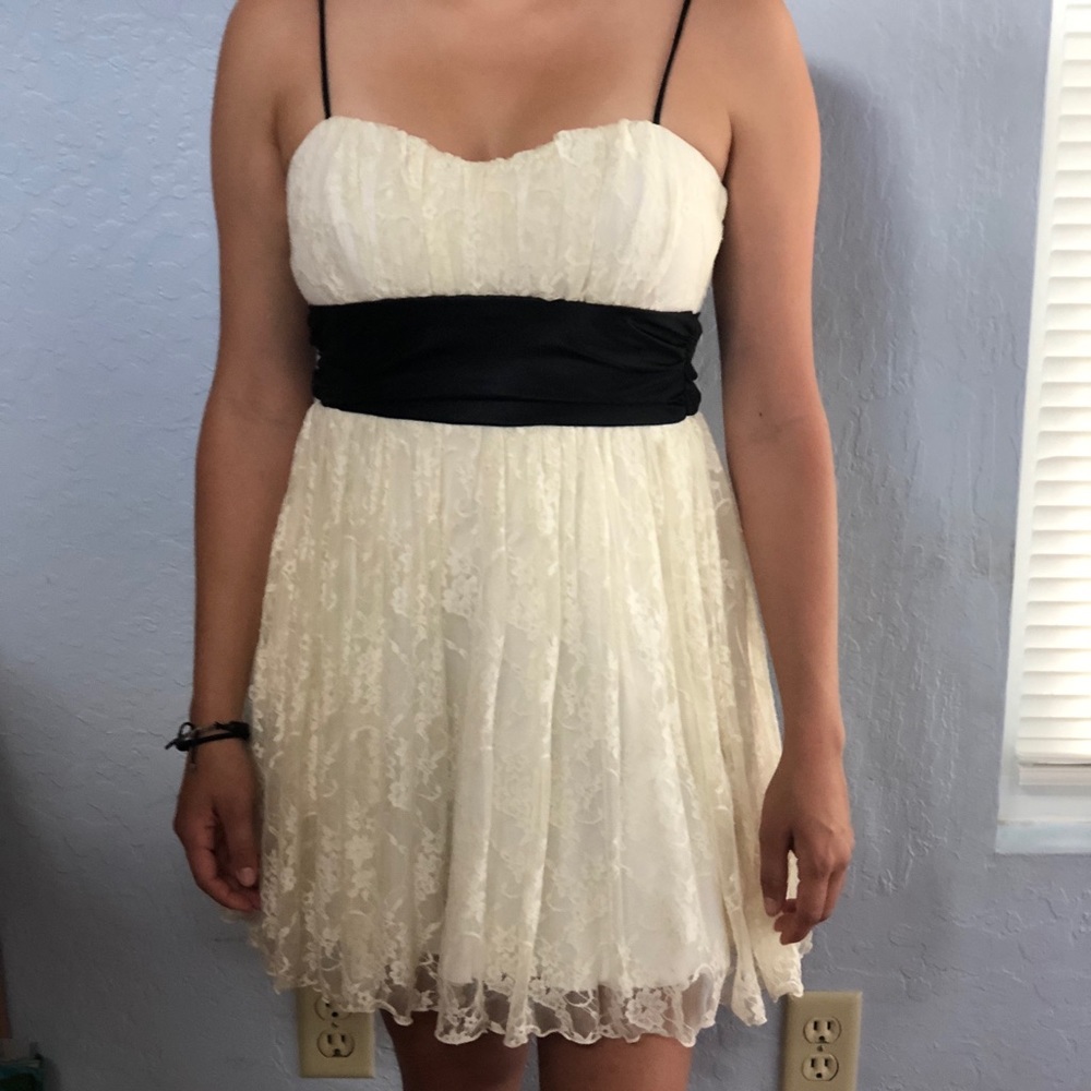White lacey homecoming dress with black silk bow